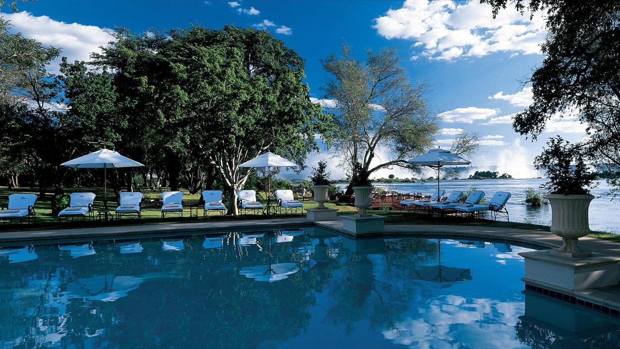 Pool area with the Victoria Falls in the background The Royal Livingstone